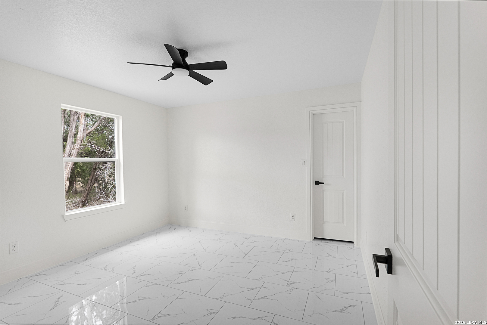 845 Tee Drive Spring Branch, TX 78070 - Photo 13 of 18 an empty room with windows and fan