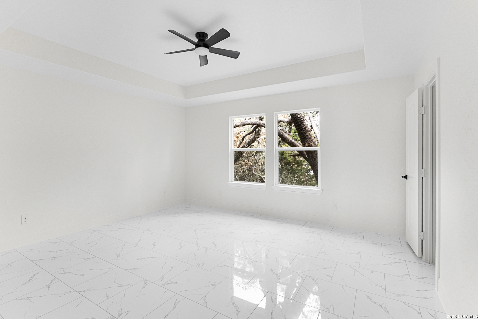 845 Tee Drive Spring Branch, TX 78070 - Photo 16 of 18 an empty room with windows and ceiling fan