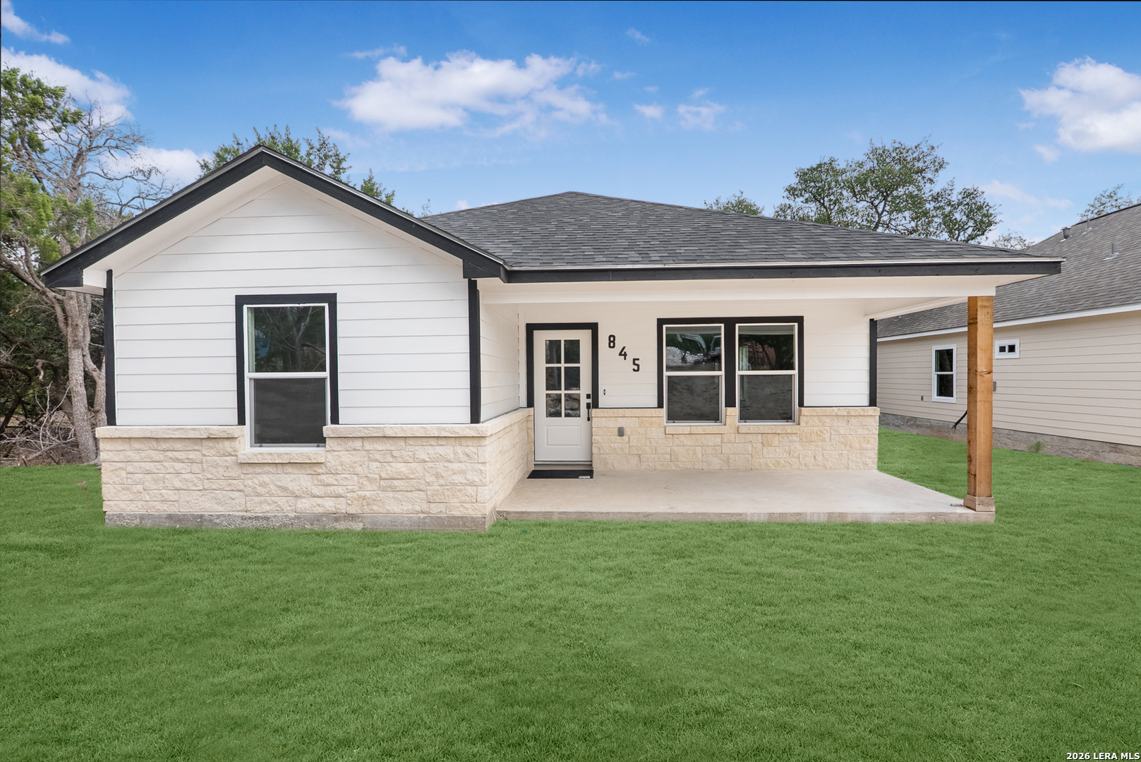 845 Tee Drive Spring Branch, TX 78070 - Photo 2 of 18 a front view of a house with a garden and yard