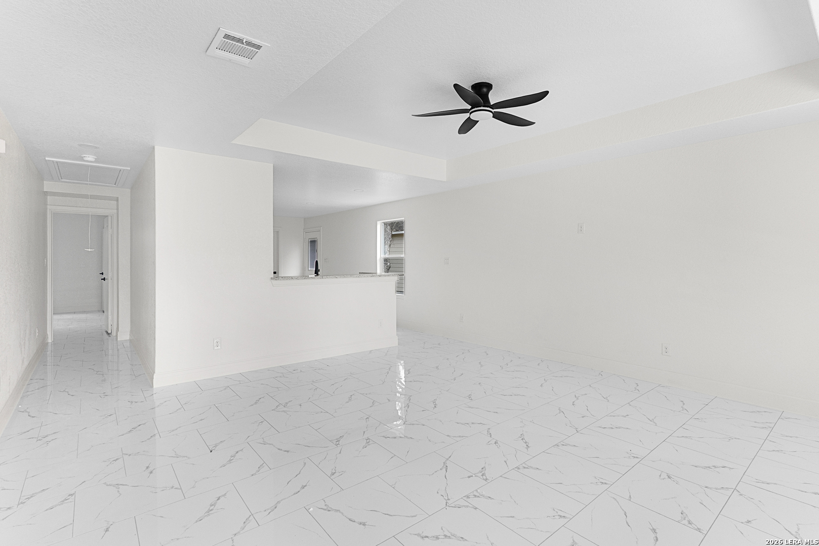 845 Tee Drive Spring Branch, TX 78070 - Photo 3 of 18 an empty room with a ceiling fan and a window