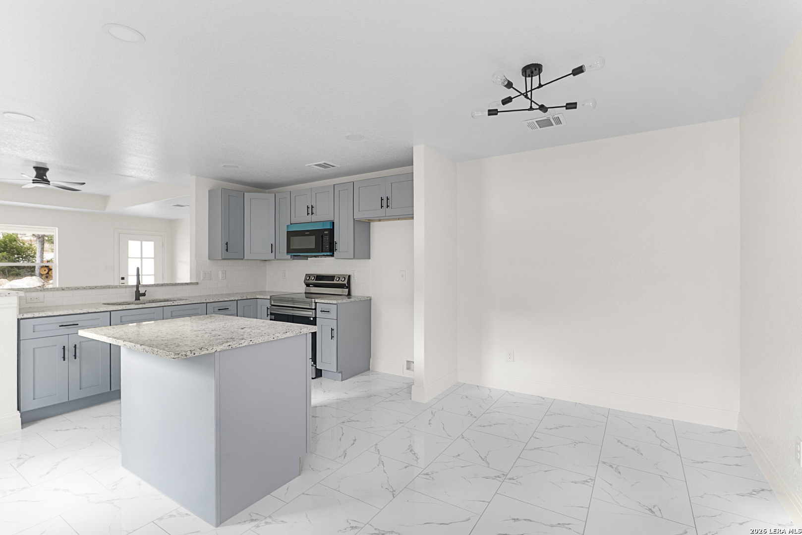 845 Tee Drive Spring Branch, TX 78070 - Photo 9 of 18 a kitchen with cabinets and stainless steel appliances