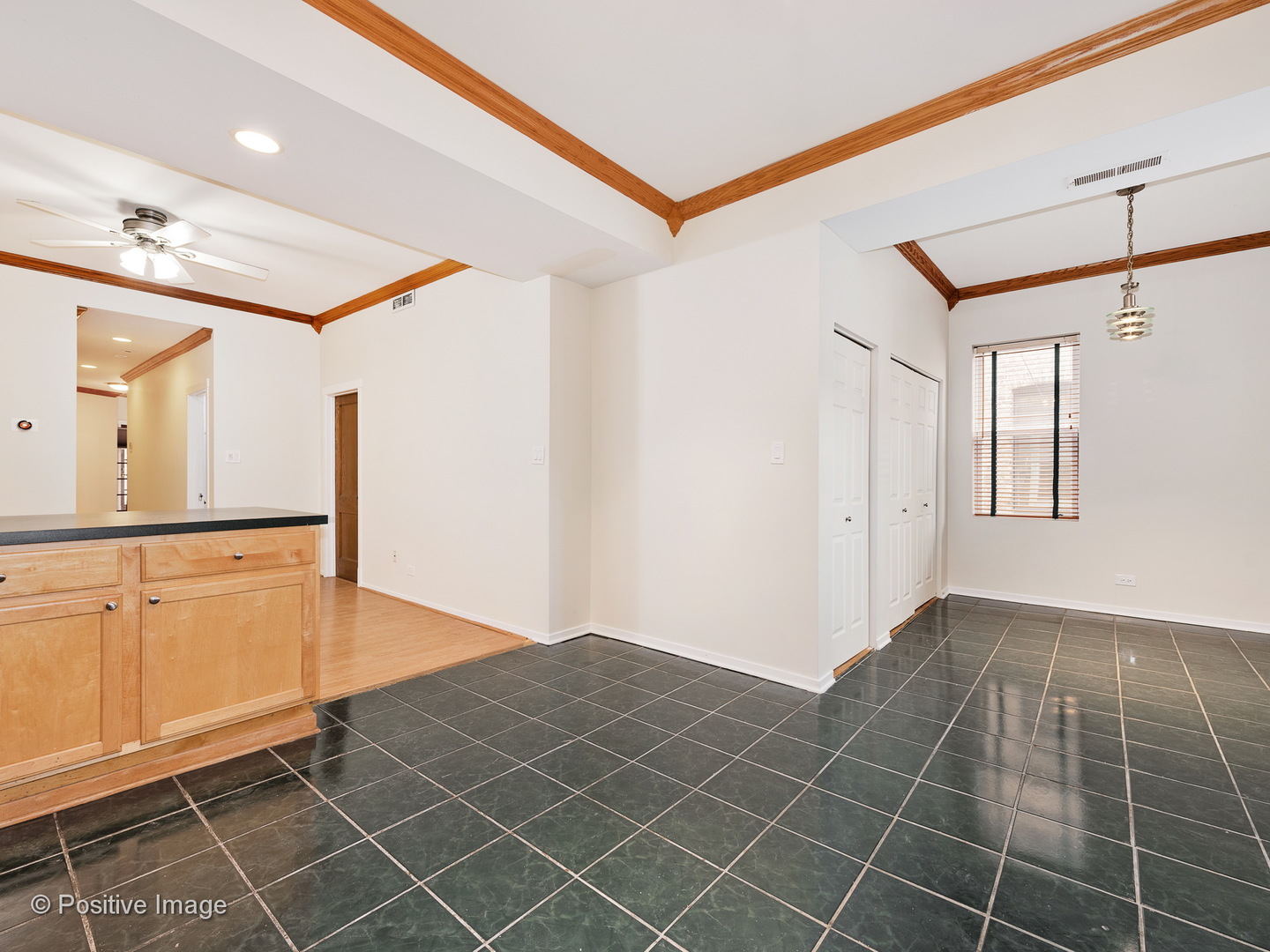 4417 North Racine Avenue, Unit 2N Chicago, IL 60640 - Photo 13 of 22 a view of a livingroom with wooden floor and cabinet