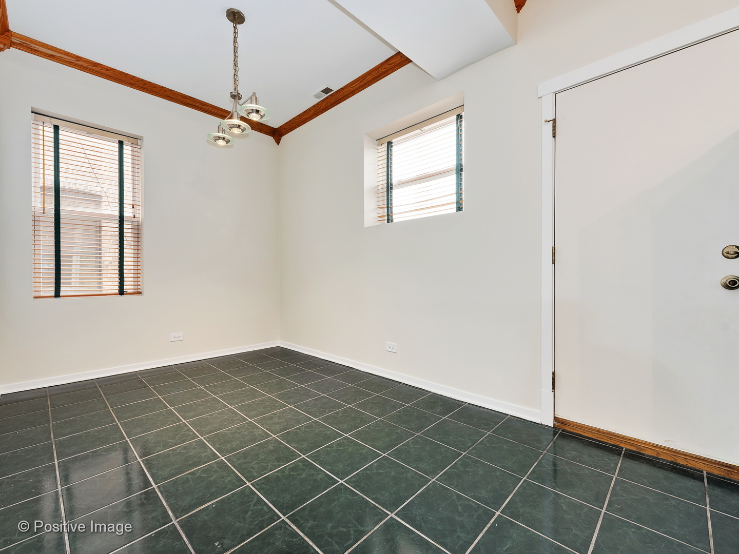 4417 North Racine Avenue, Unit 2N Chicago, IL 60640 - Photo 14 of 22 a view of an empty room with a window