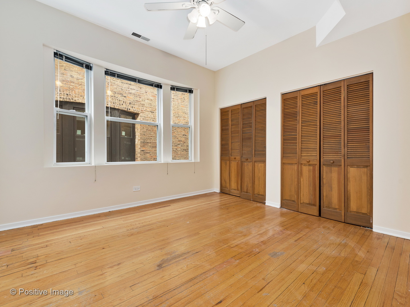 4417 North Racine Avenue, Unit 2N Chicago, IL 60640 - Photo 16 of 22 a view of an empty room with a window