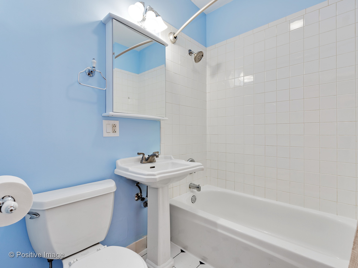 4417 North Racine Avenue, Unit 2N Chicago, IL 60640 - Photo 17 of 22 a bathroom with a sink a toilet and shower
