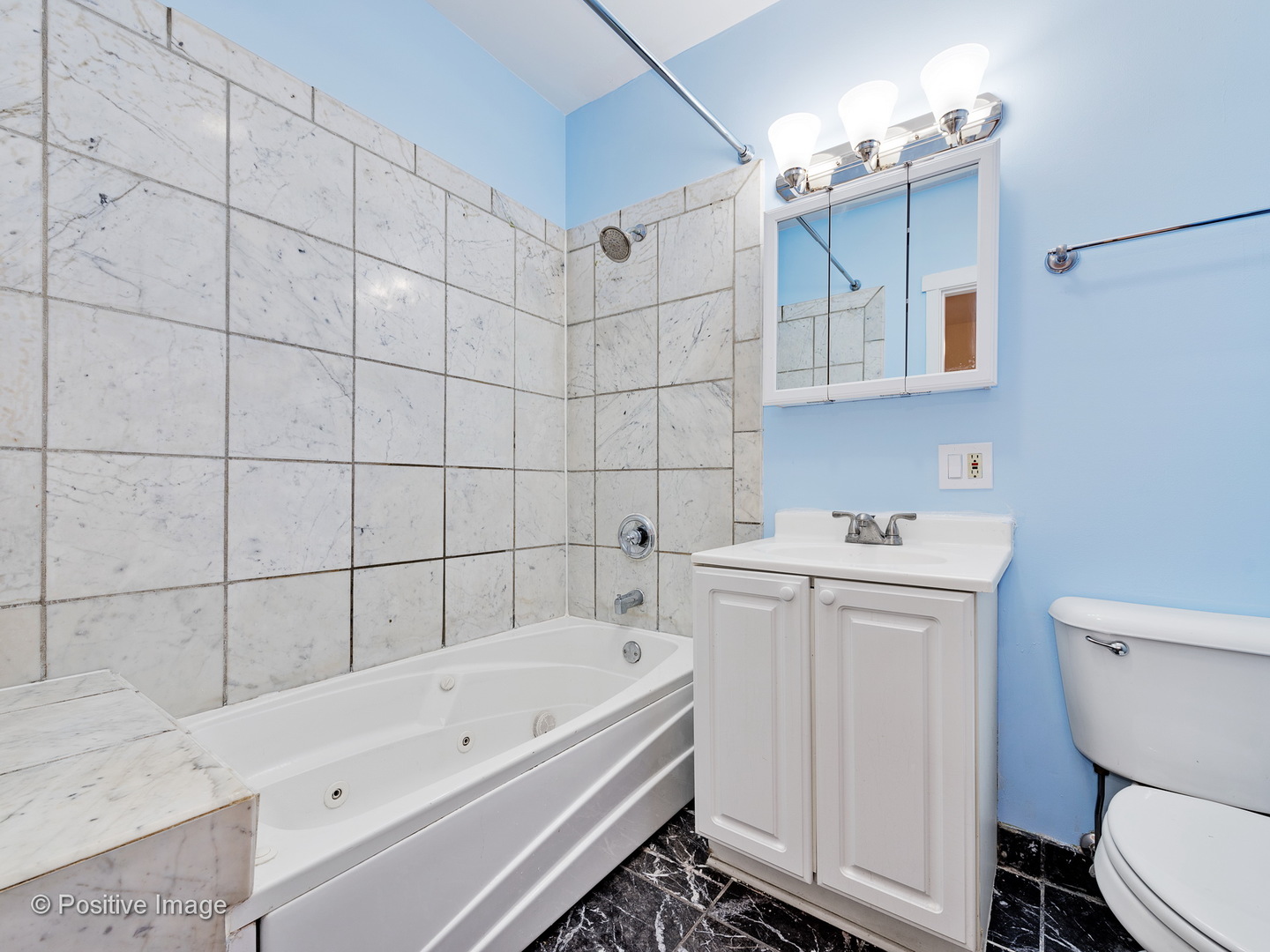 4417 North Racine Avenue, Unit 2N Chicago, IL 60640 - Photo 20 of 22 a bathroom with a sink a toilet and shower