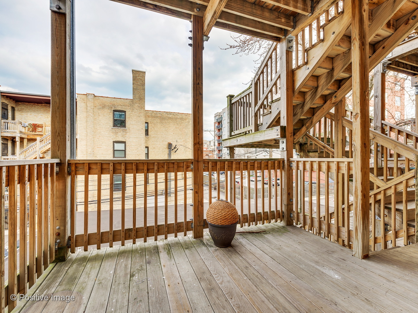 4417 North Racine Avenue, Unit 2N Chicago, IL 60640 - Photo 22 of 22 a view of a balcony with wooden floor