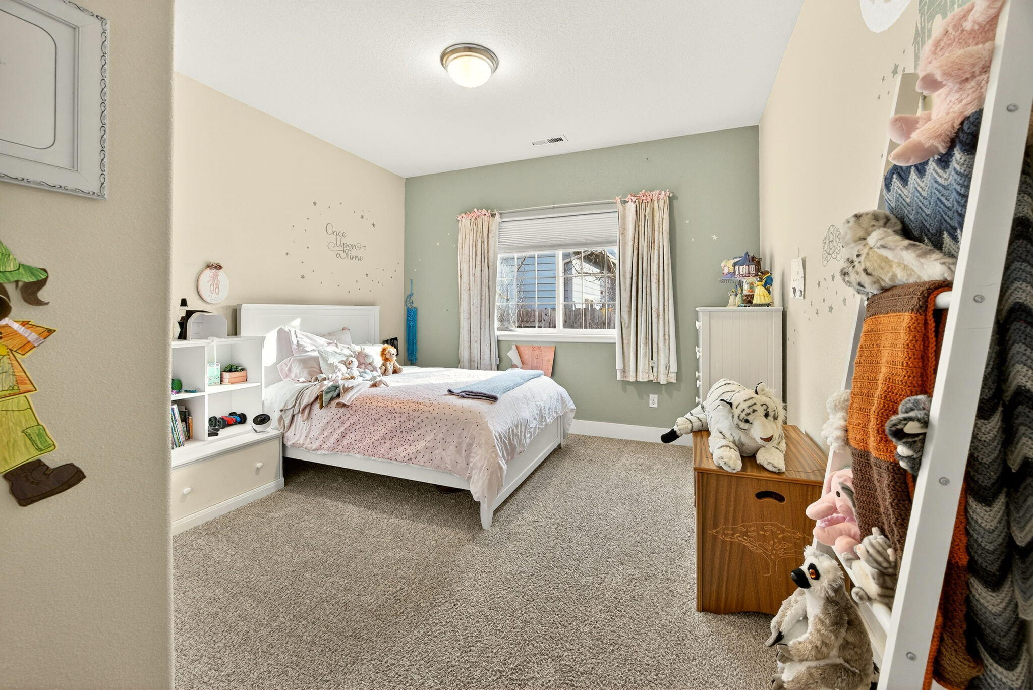 16 Portabello Way Eagle Point, OR 97524 - Photo 26 of 43 a bedroom with a bed couch and windows