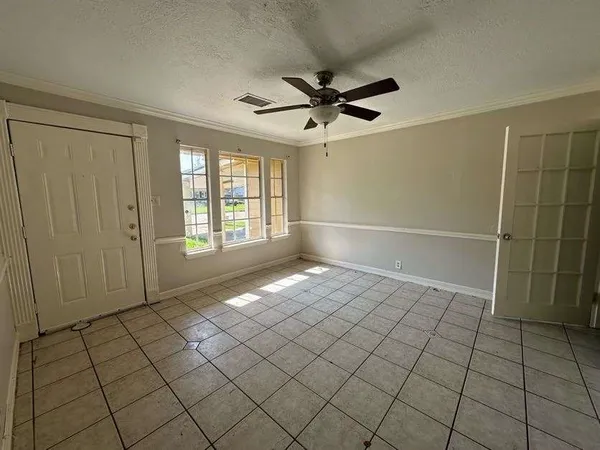 a view of an empty room and window