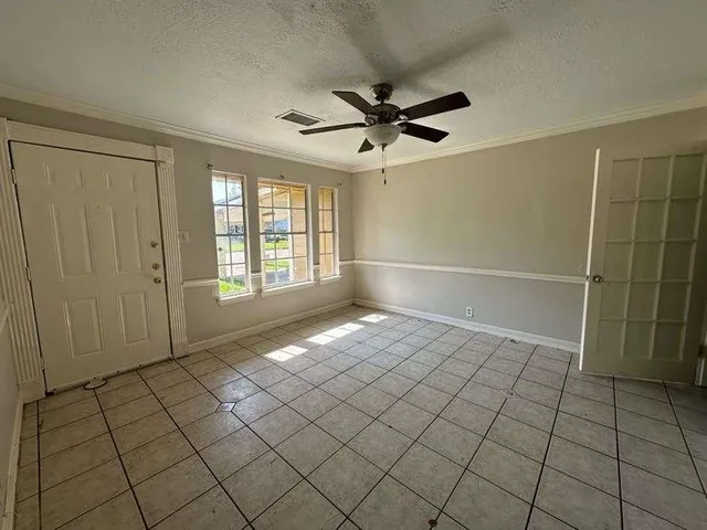a view of an empty room and window