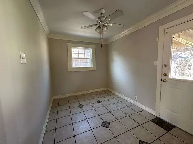 a view of an empty room and window