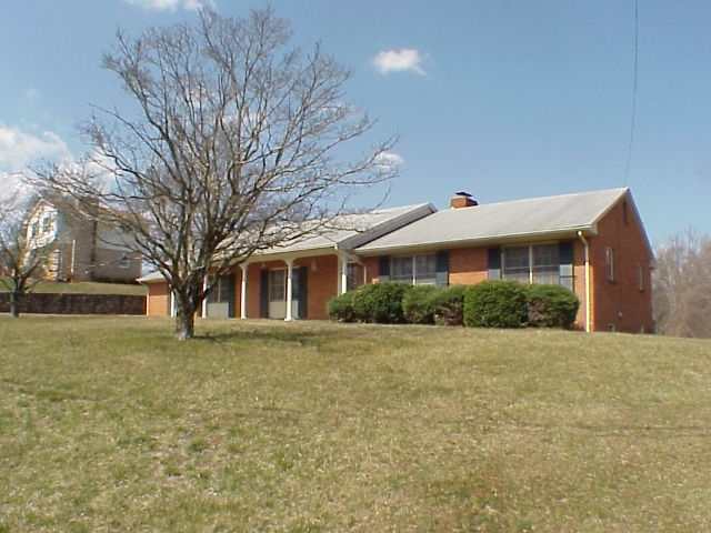 4521 Rosecrest Road Roanoke, VA 24018 - Photo 1 of 27 a front view of house with yard and trees around