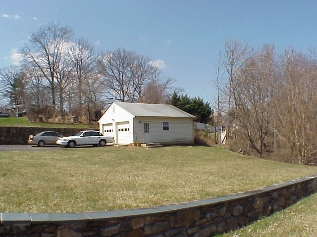 4521 Rosecrest Road Roanoke, VA 24018 - Photo 11 of 27 a view of a house with a yard covered in snow