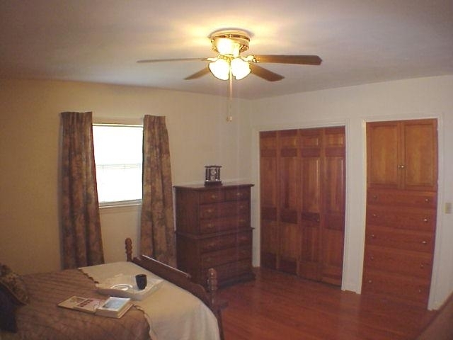 4521 Rosecrest Road Roanoke, VA 24018 - Photo 13 of 27 a bedroom with a bed and a chandelier