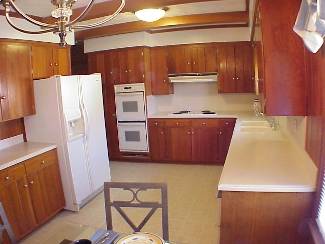 4521 Rosecrest Road Roanoke, VA 24018 - Photo 3 of 27 a kitchen with stainless steel appliances a refrigerator and a stove top oven