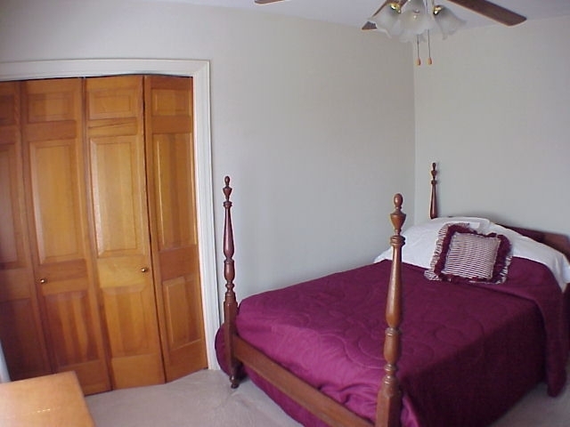 4521 Rosecrest Road Roanoke, VA 24018 - Photo 26 of 27 a bedroom with a bed and a table