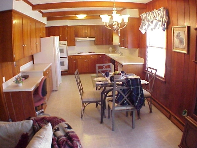 4521 Rosecrest Road Roanoke, VA 24018 - Photo 6 of 27 a dining room with furniture and a chandelier