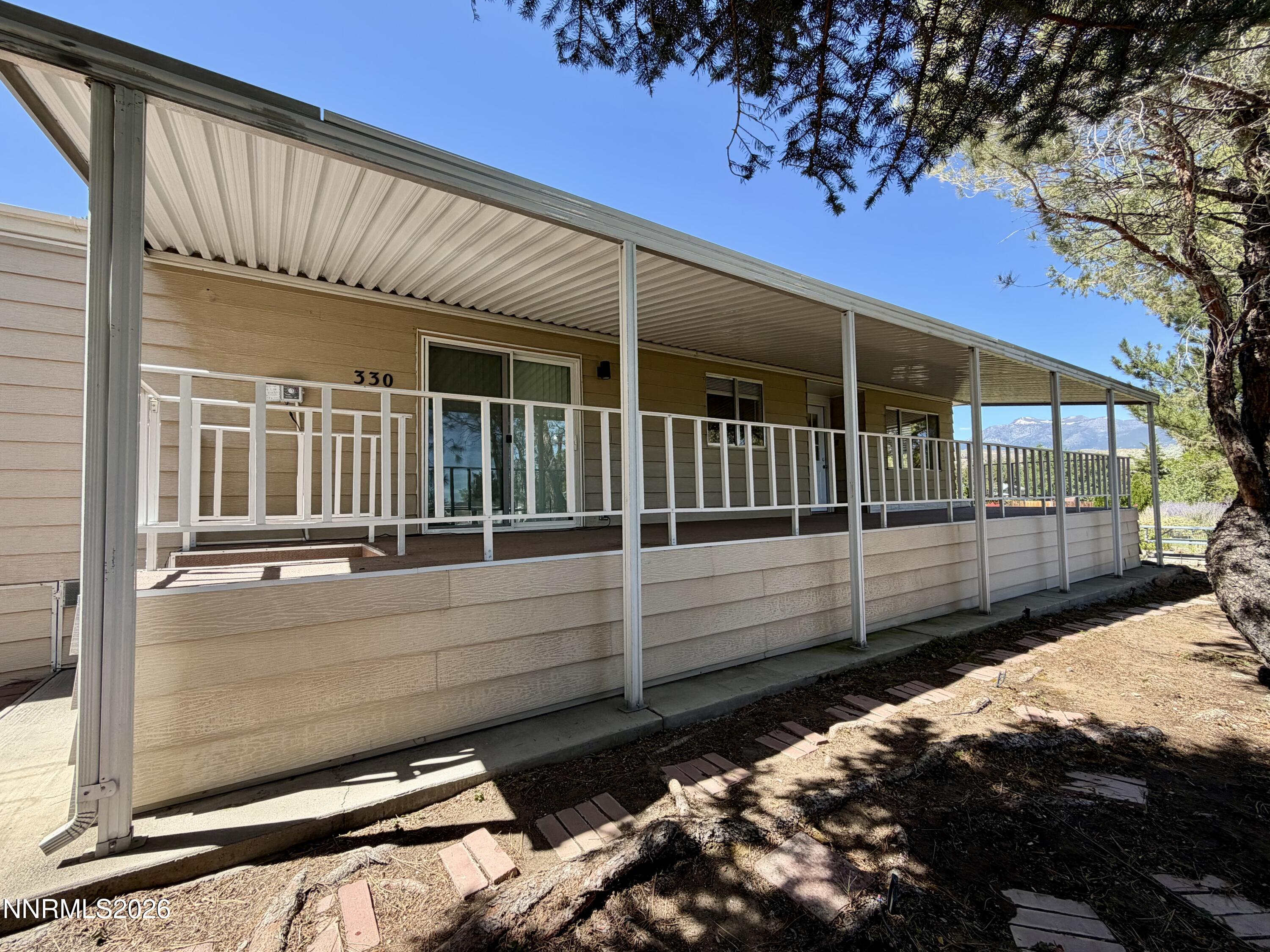 330 Taurus Circle Reno, NV 89521 - Photo 25 of 27 a view of a house with a wooden fence