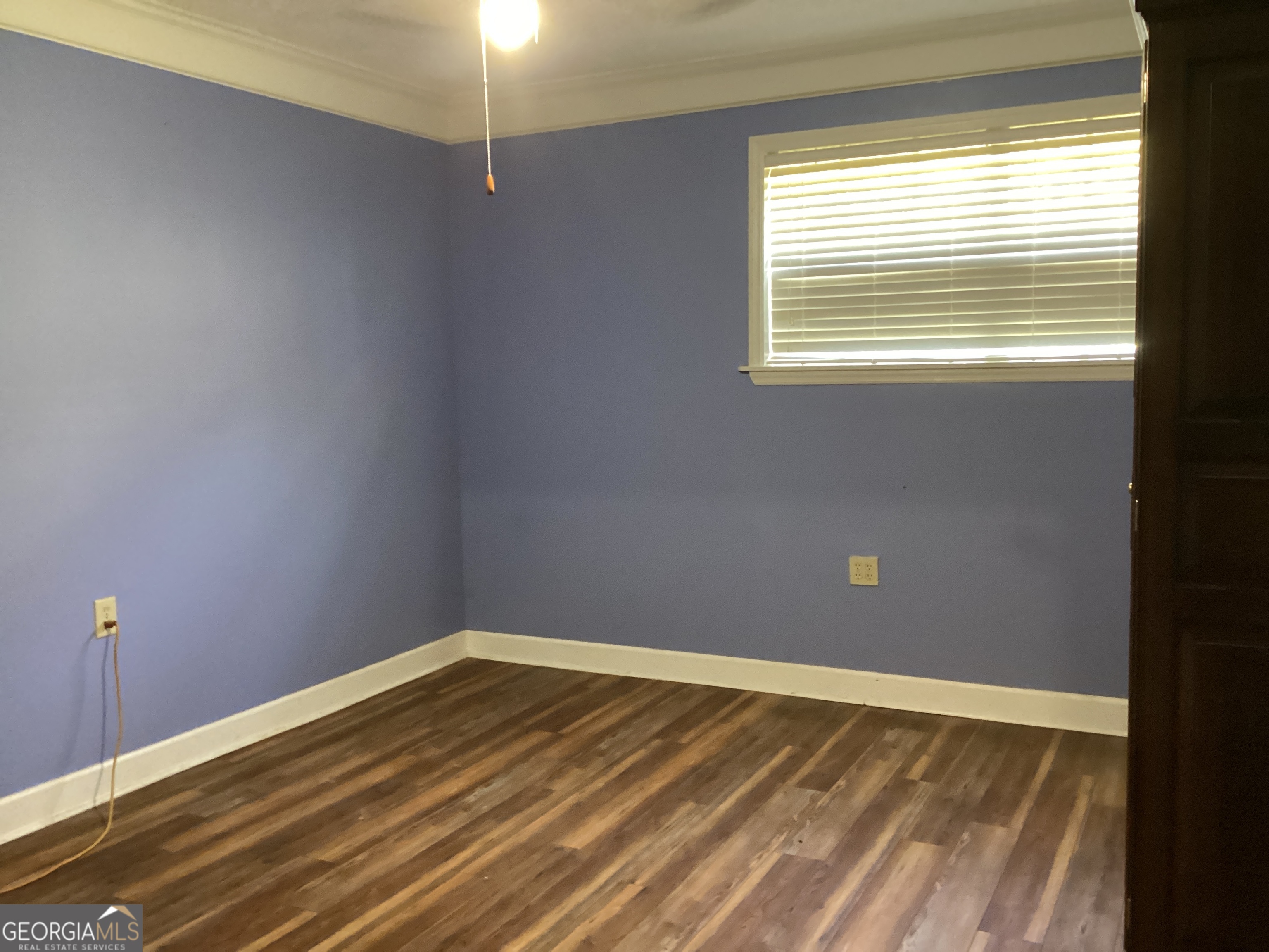 220 Ennis Road Barnesville, GA 30204 - Photo 42 of 47 a view of a room with wooden floor and windows