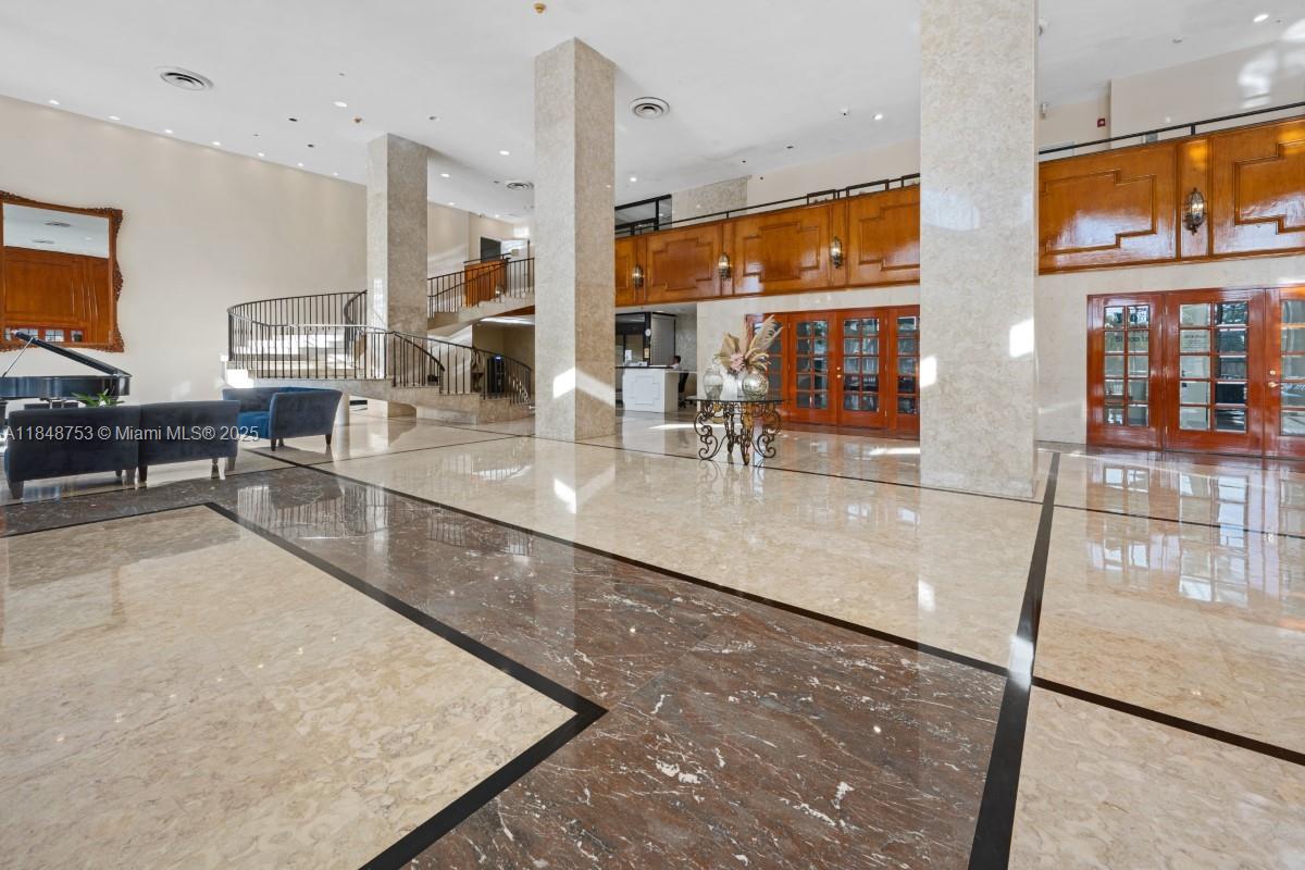 5601 Collins Avenue, Unit 511 Miami Beach, FL 33140 - Photo 31 of 34 a view of a living room and chandelier