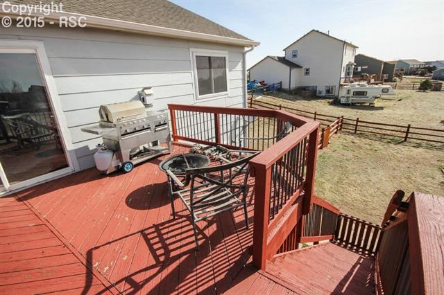 12475 Snaffle Bit Road Peyton, CO 80831 - Photo 4 of 35 Deck and Stairs