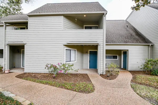 a front view of a house with yard