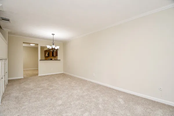 an empty room with a empty space and window