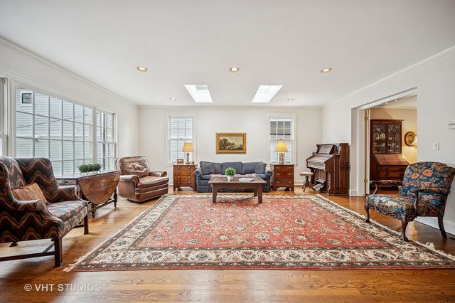 a living room with furniture or couch and a wooden floor