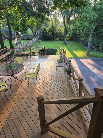 a view of backyard with sitting area