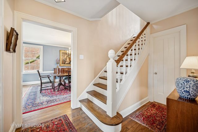 a view of a hallway view with furniture and rug