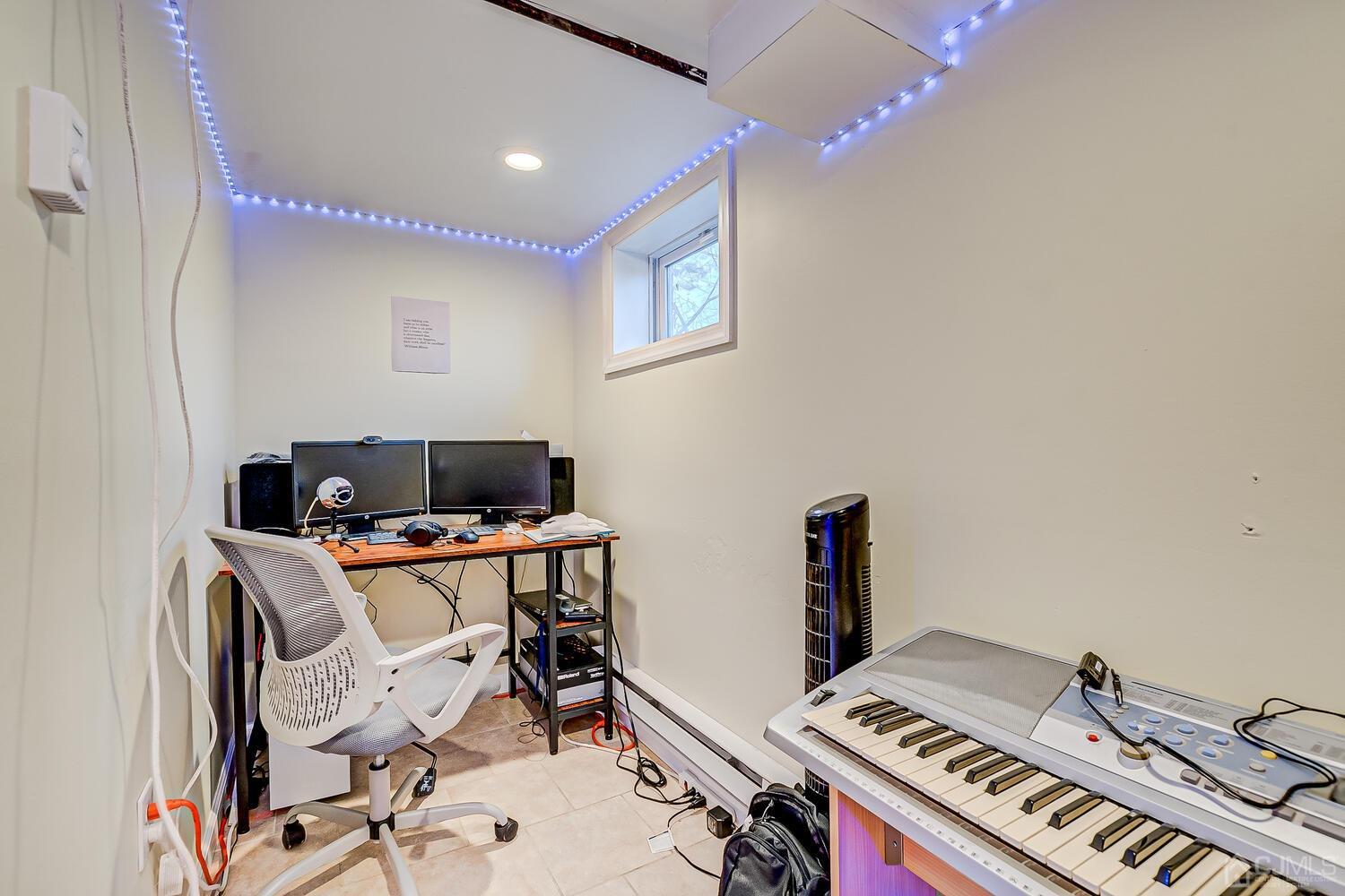 32 Prosper Street New Brunswick, NJ 08901 - Photo 18 of 30 a work room with furniture and musical instruments