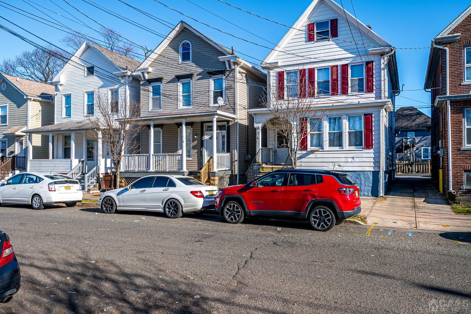 32 Prosper Street New Brunswick, NJ 08901 - Photo 2 of 30 a cars parked in front of a building