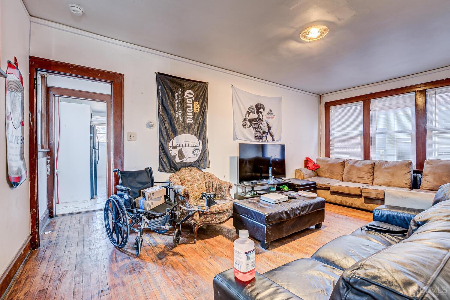 32 Prosper Street New Brunswick, NJ 08901 - Photo 21 of 30 a living room with furniture fireplace and a large window