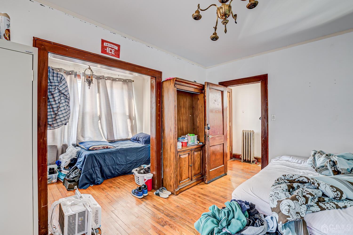 32 Prosper Street New Brunswick, NJ 08901 - Photo 29 of 30 a bedroom with furniture and wooden floor