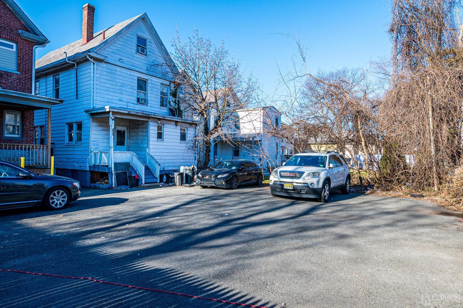 32 Prosper Street New Brunswick, NJ 08901 - Photo 4 of 30 a car parked in front of a house