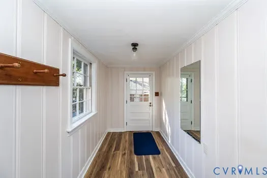 a room with pool table and a window