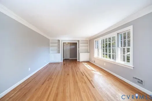 a kitchen with granite countertop a refrigerator stove and microwave