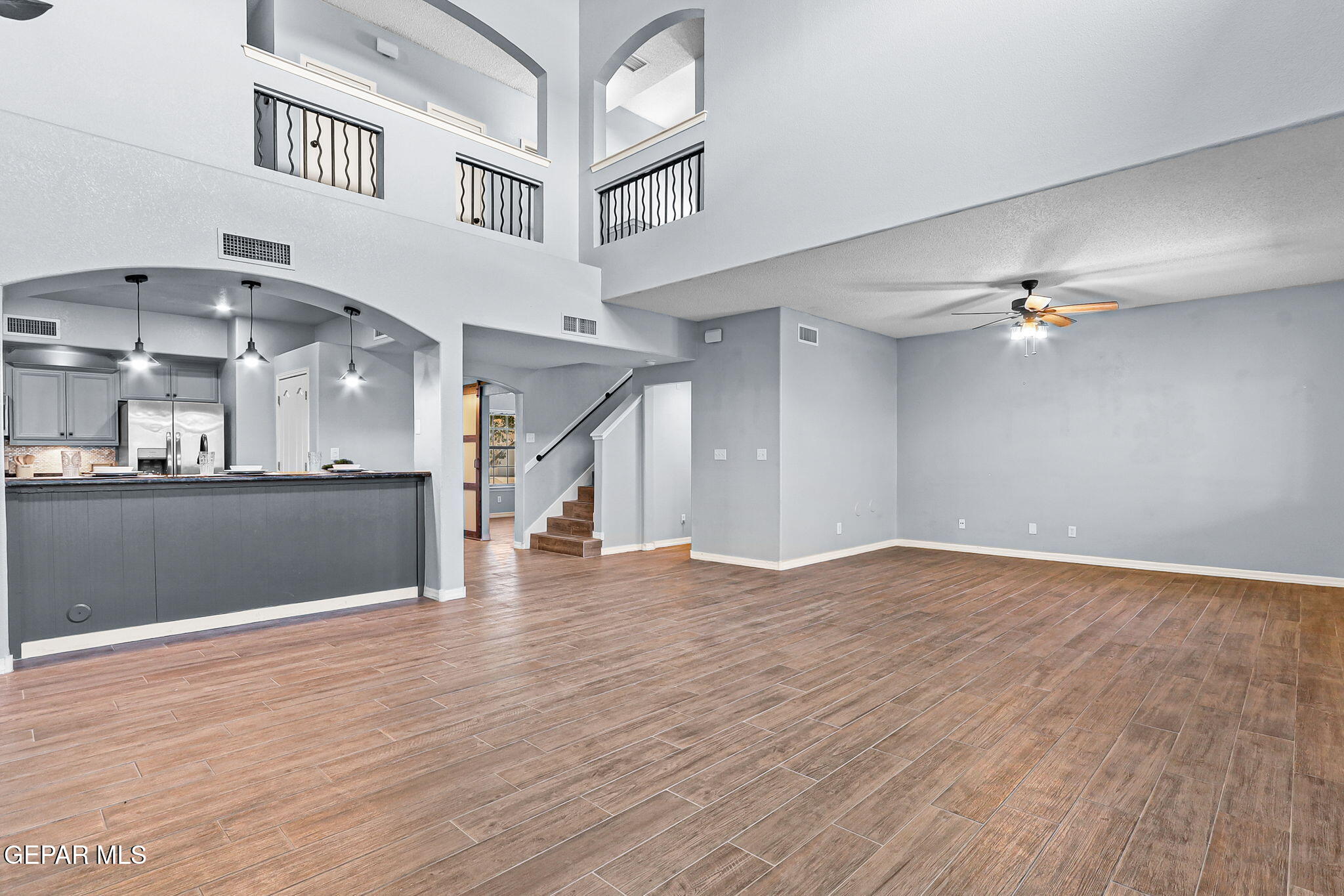 14045 Tower Point Way El Paso, TX 79938 - Photo 16 of 46 a view of an empty room with wooden floor