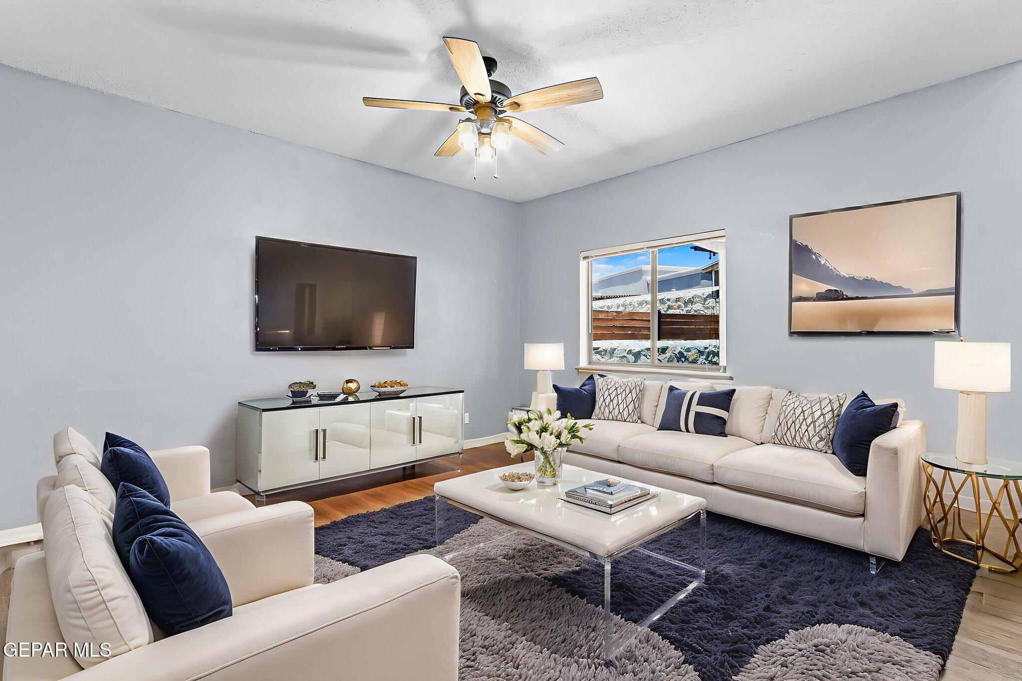 14045 Tower Point Way El Paso, TX 79938 - Photo 20 of 46 a living room with furniture and a flat screen tv
