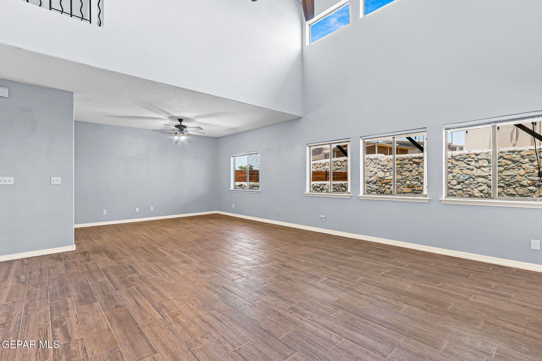 14045 Tower Point Way El Paso, TX 79938 - Photo 21 of 46 wooden floor in an empty room with a window