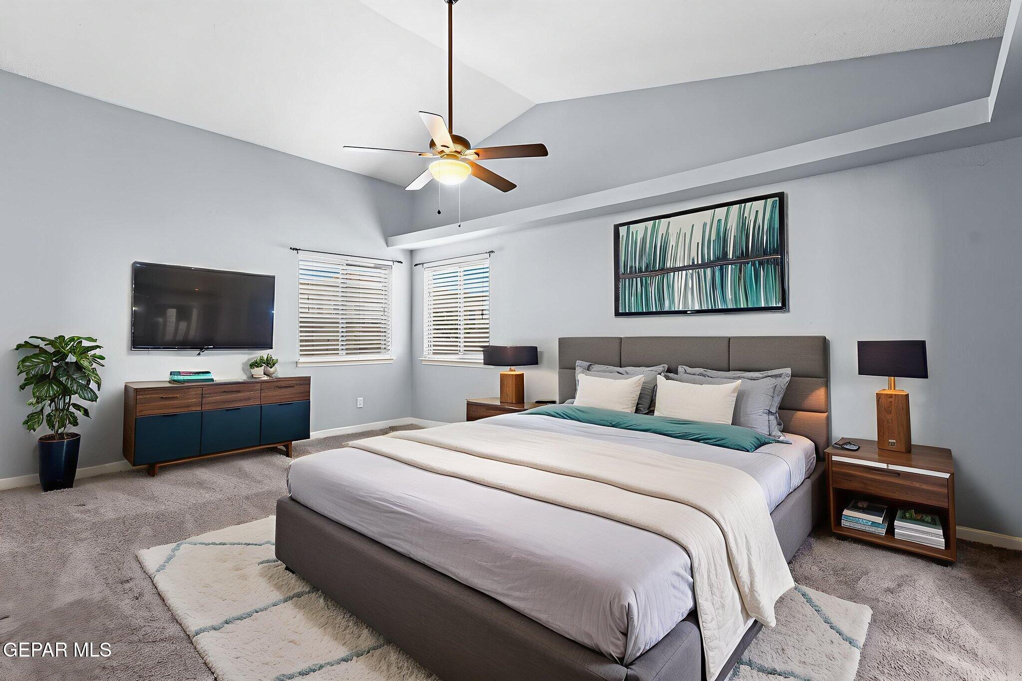 14045 Tower Point Way El Paso, TX 79938 - Photo 22 of 46 a bedroom with a bed a window and a flat screen tv