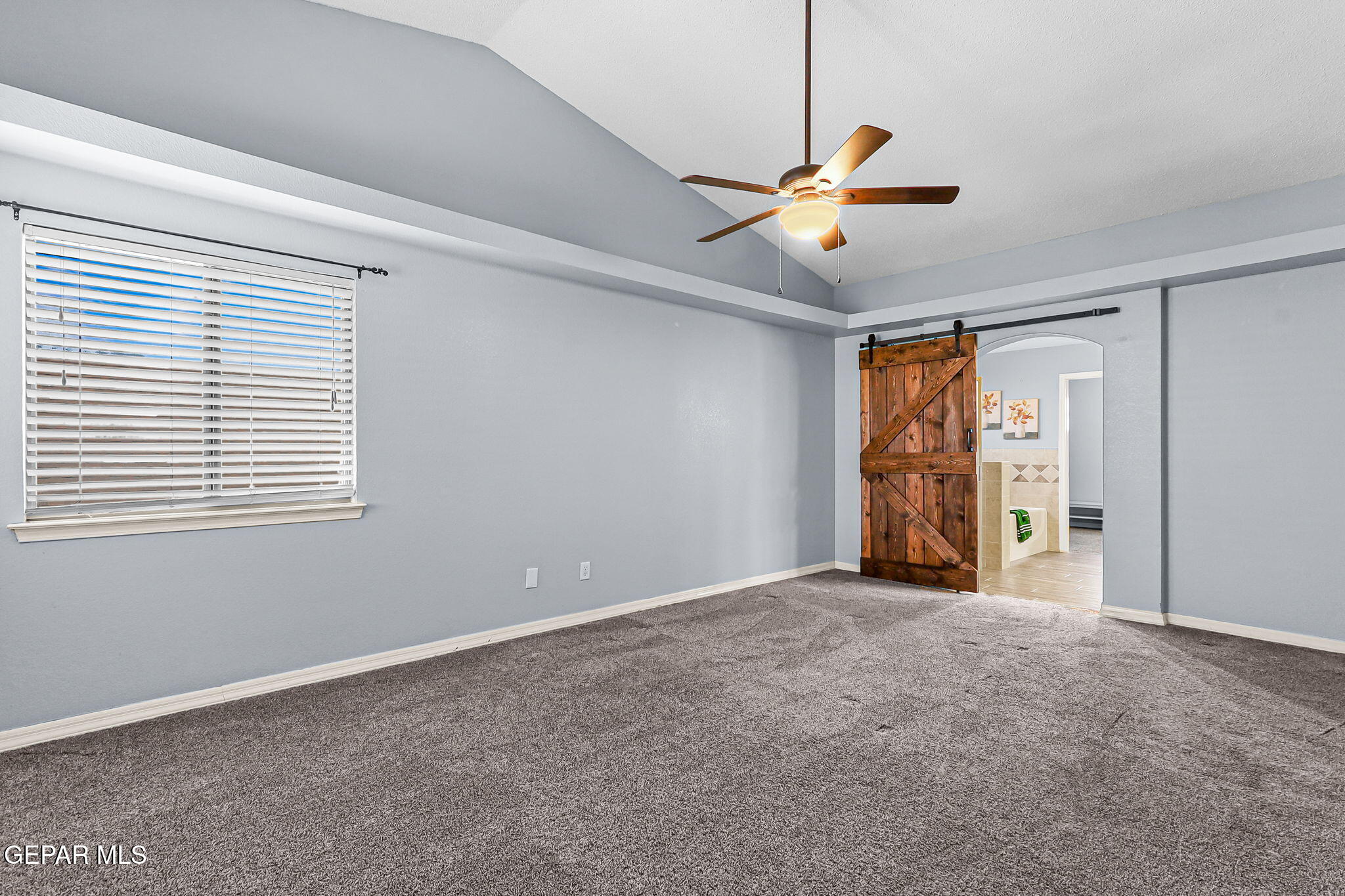 14045 Tower Point Way El Paso, TX 79938 - Photo 25 of 46 a view of an empty room with window and chandelier fan