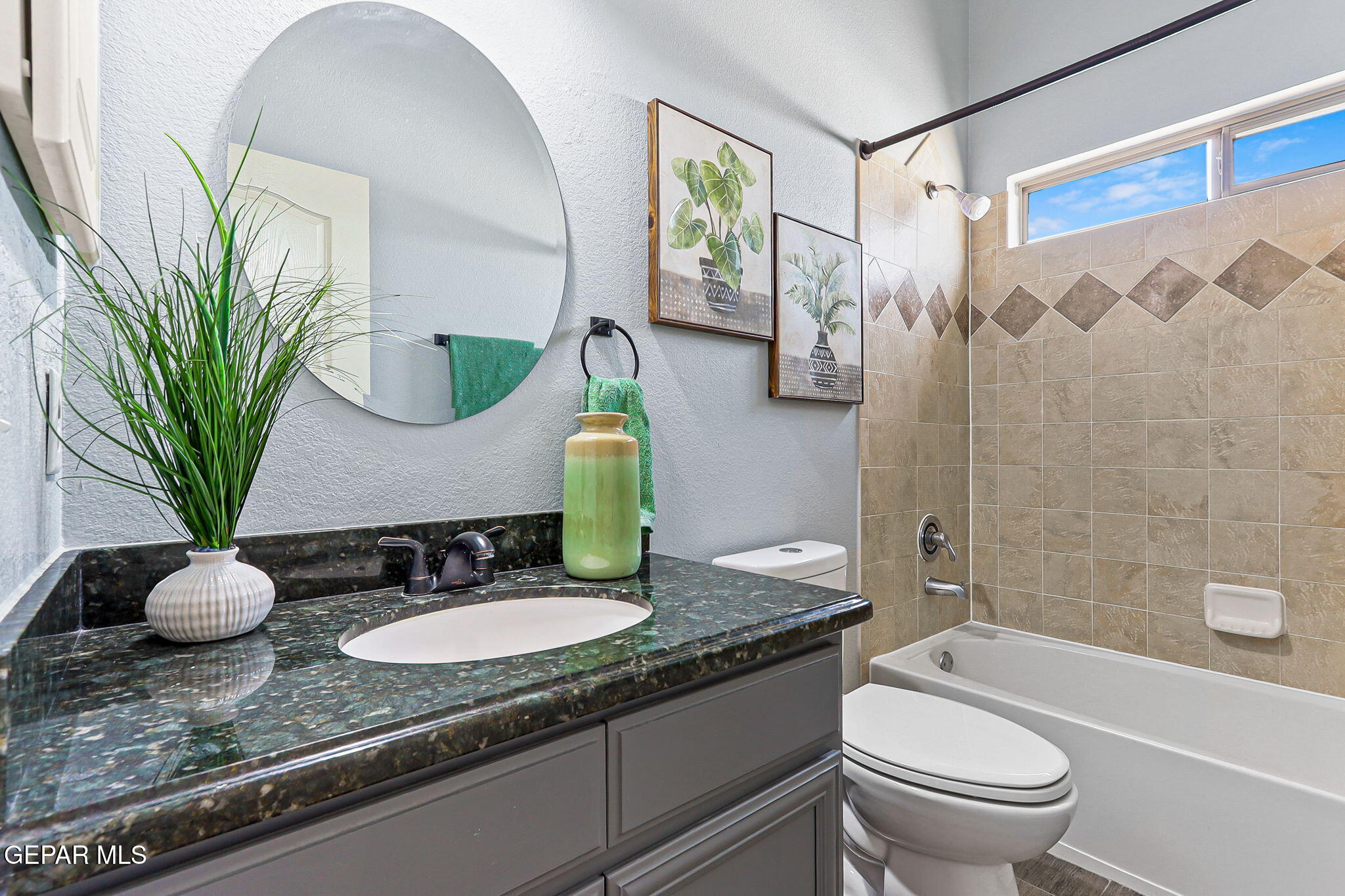 14045 Tower Point Way El Paso, TX 79938 - Photo 30 of 46 a bathroom with a granite countertop sink a toilet and bathtub