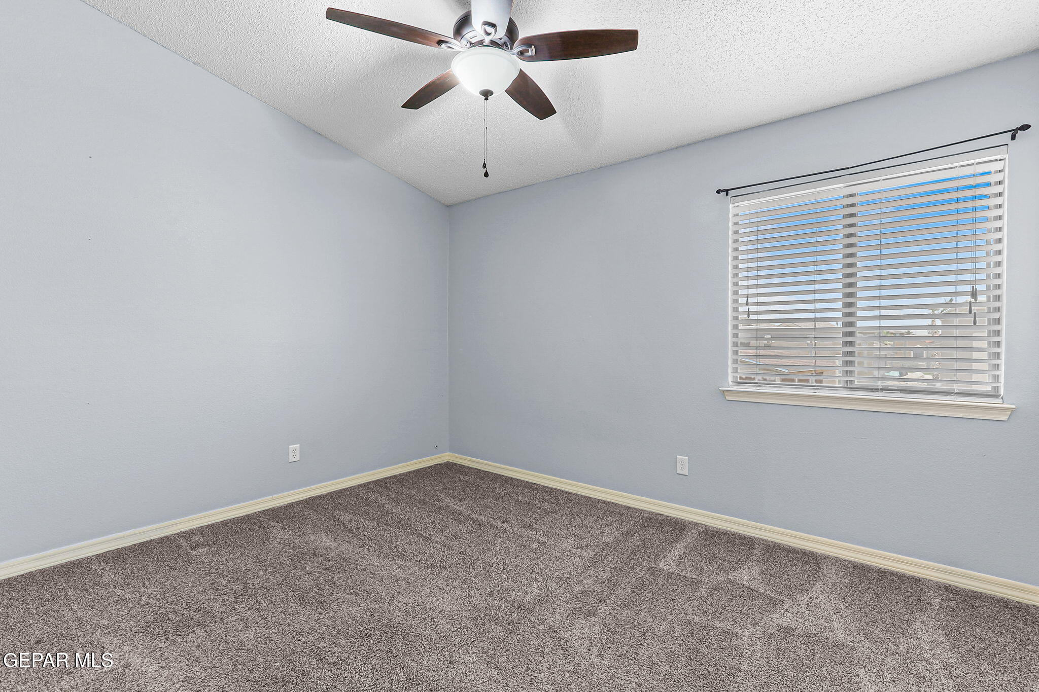 14045 Tower Point Way El Paso, TX 79938 - Photo 32 of 46 an empty room with a window and a fan