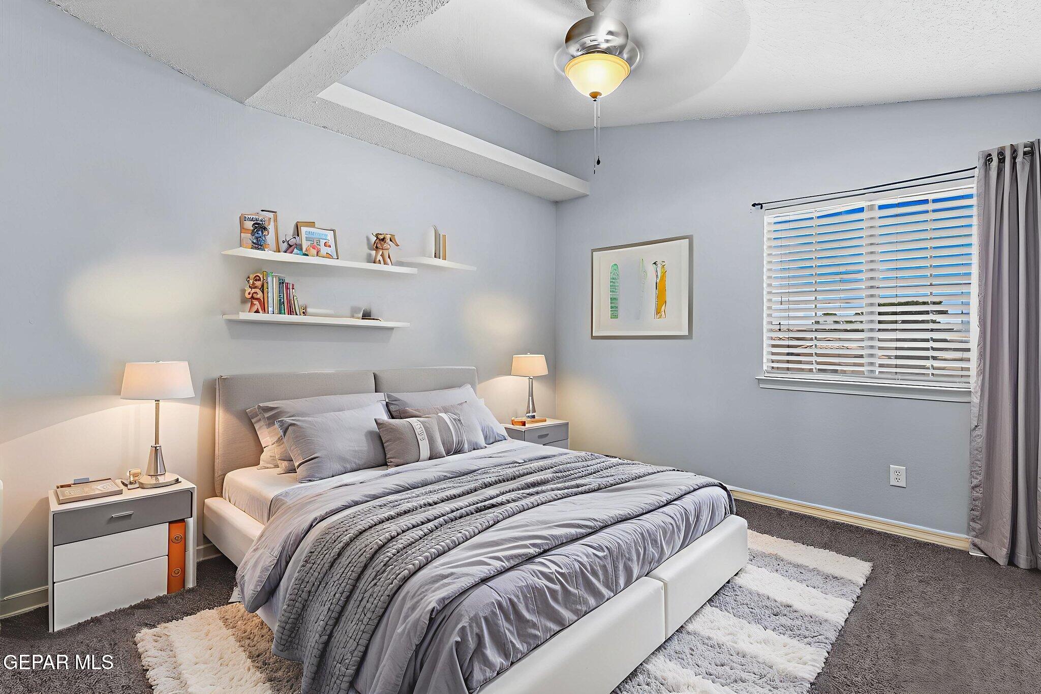 14045 Tower Point Way El Paso, TX 79938 - Photo 33 of 46 a bedroom with a bed and painting on the wall