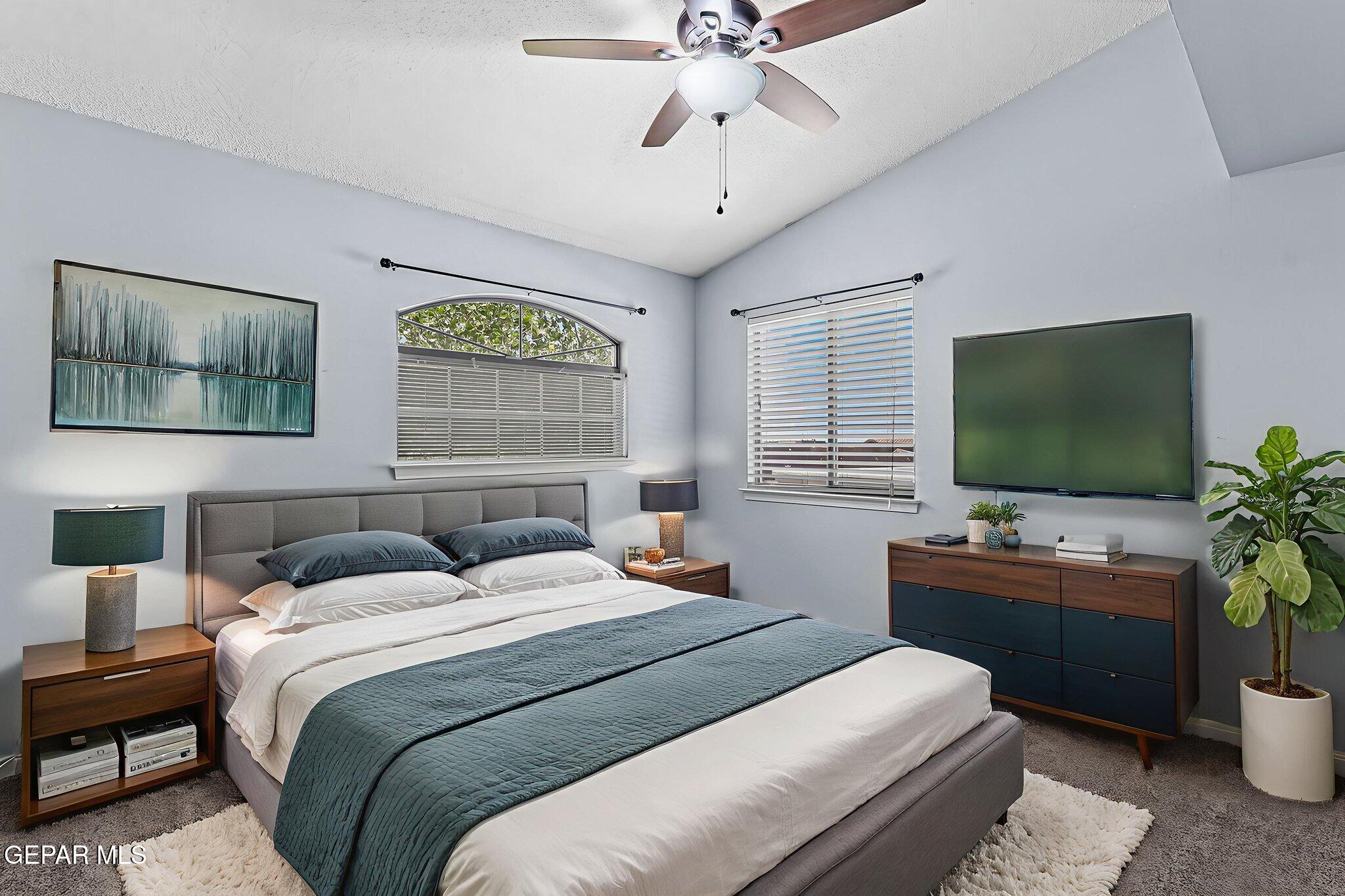 14045 Tower Point Way El Paso, TX 79938 - Photo 35 of 46 a bedroom with a bed and a flat screen tv