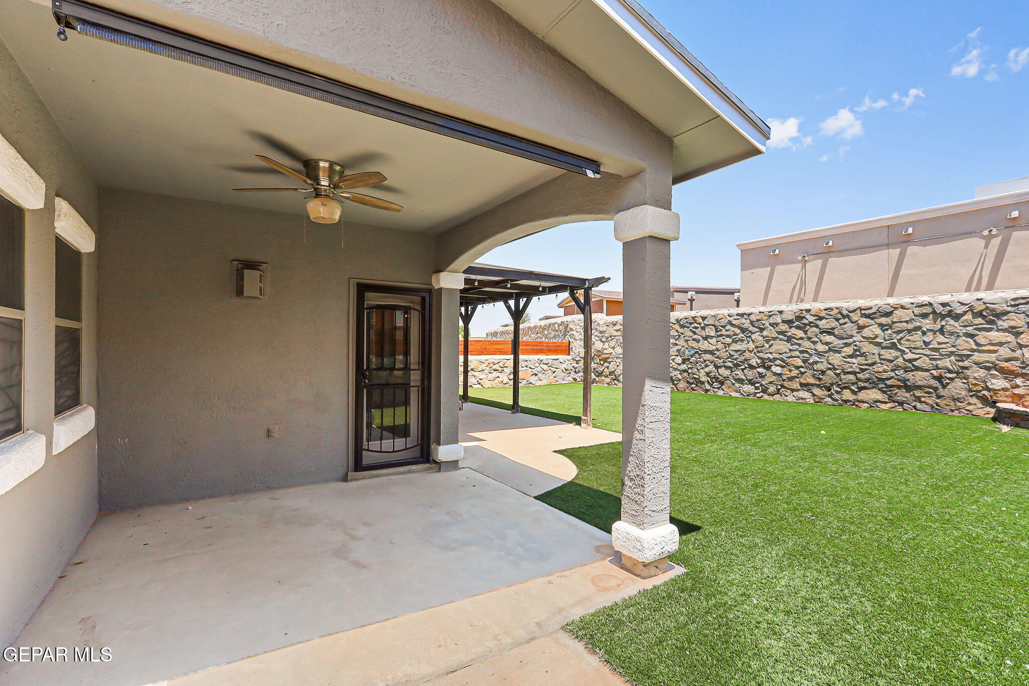 14045 Tower Point Way El Paso, TX 79938 - Photo 38 of 46 a view of a porch with a backyard
