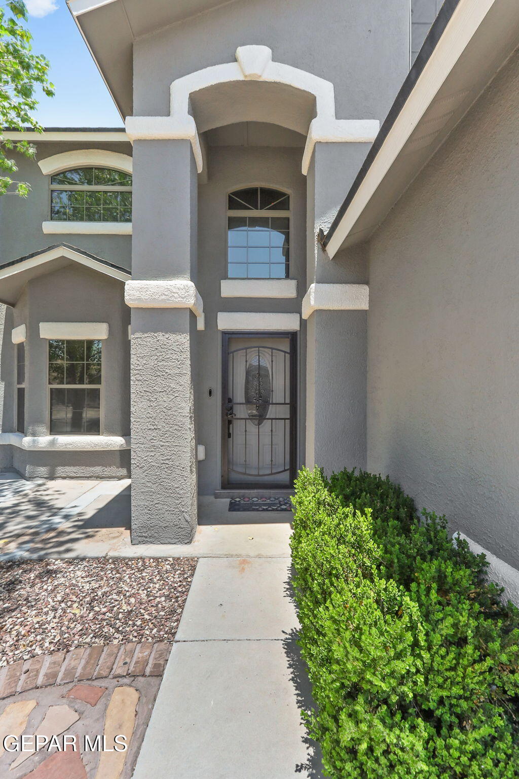 14045 Tower Point Way El Paso, TX 79938 - Photo 4 of 46 a front view of a house with garden