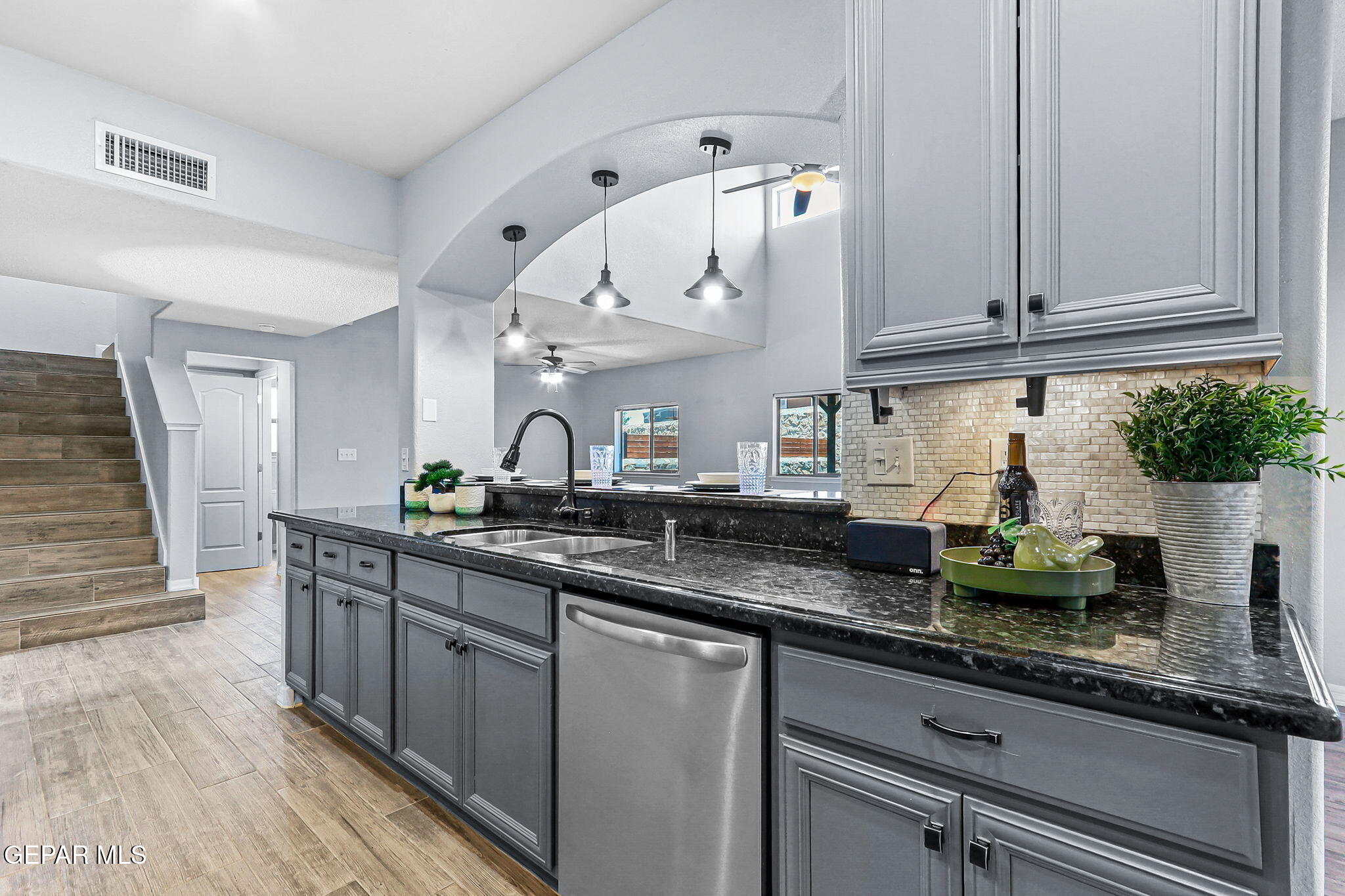 14045 Tower Point Way El Paso, TX 79938 - Photo 8 of 46 a kitchen with lots of counter space and wooden floor