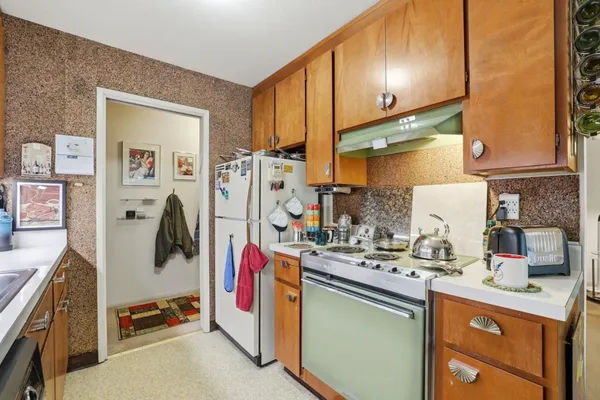 a bedroom with furniture and a large window